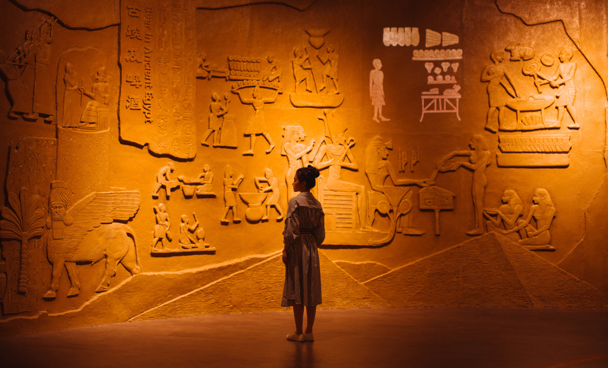 Girl looking at ancient Egyptian writing